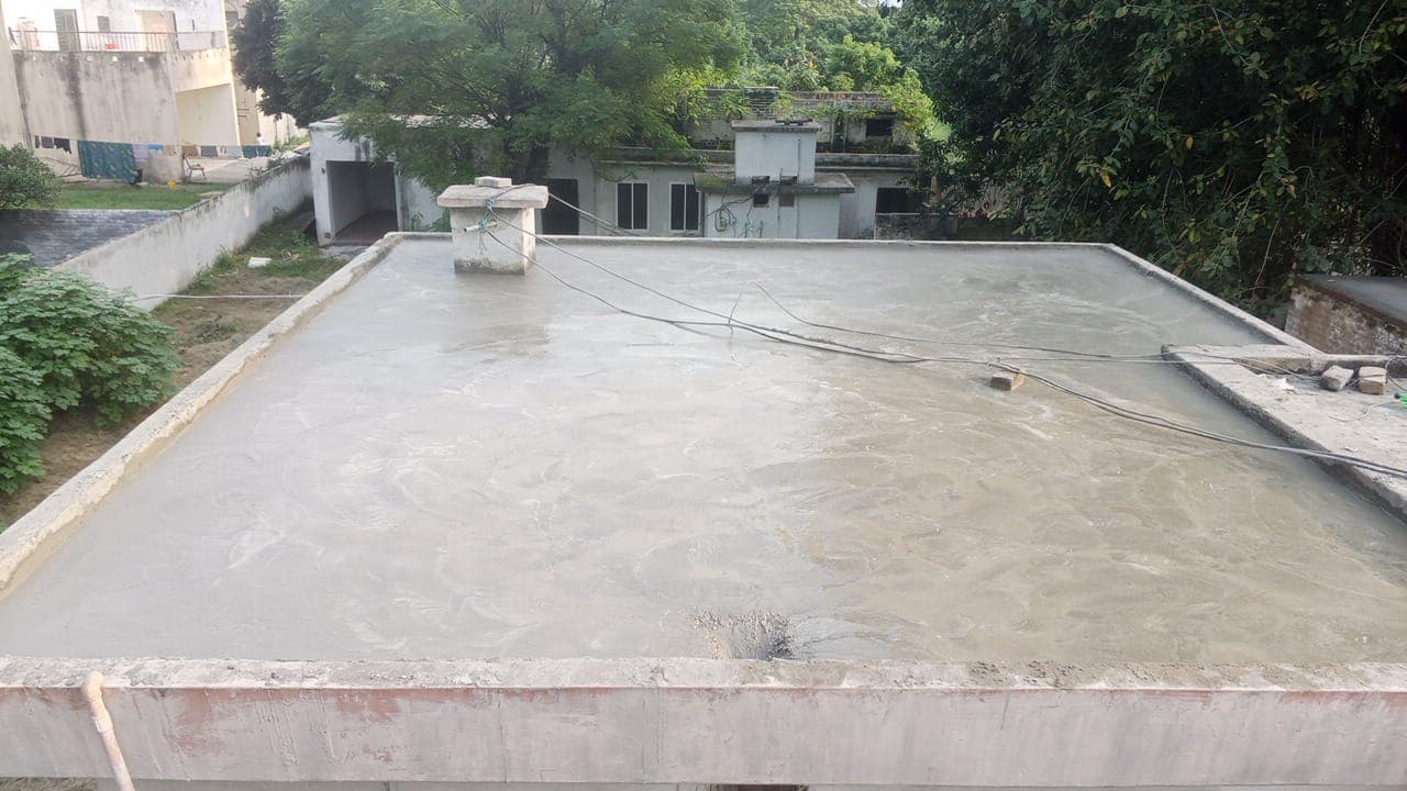 A bare, plastered flat roof cleaned and ready for waterproofing